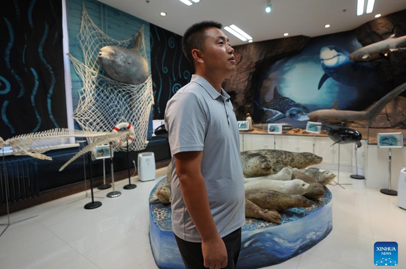 Wang Zhen checks specimens in the Liaoning Ocean and Fisheries Science Research Institute in Dalian, northeast China's Liaoning Province, Sept. 6, 2024. Photo: Xinhua