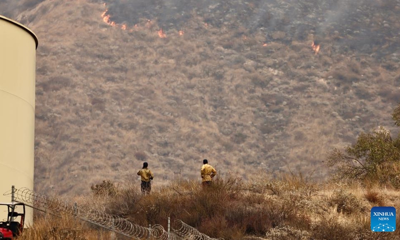 Firefighters work near the site of a wildfire in San Bernardino County, California, the United States, Sept. 7, 2024. An unrelenting heat wave has engulfed Southern California this week with temperatures in some areas reaching record highs on Friday. Hundreds of firefighters are battling a fast-moving wildfire in high temperatures in San Bernardino County, which grew to 1180 acres (about 4.8 square km) with 24 hours. Photo: Xinhua