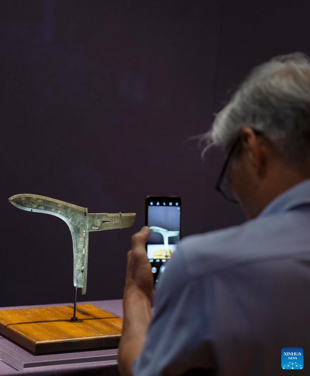 A visitor takes photos at an exhibition The Splendor of Chinese Bronzes: Masterpieces from the National Museum of China at Macao Museum of Art in Macao, south China, Sept. 6, 2024. The exhibition kicked off on Friday in Macao, showcasing more than 150 ancient bronzes from the collection of the National Museum of China. Photo: Xinhua