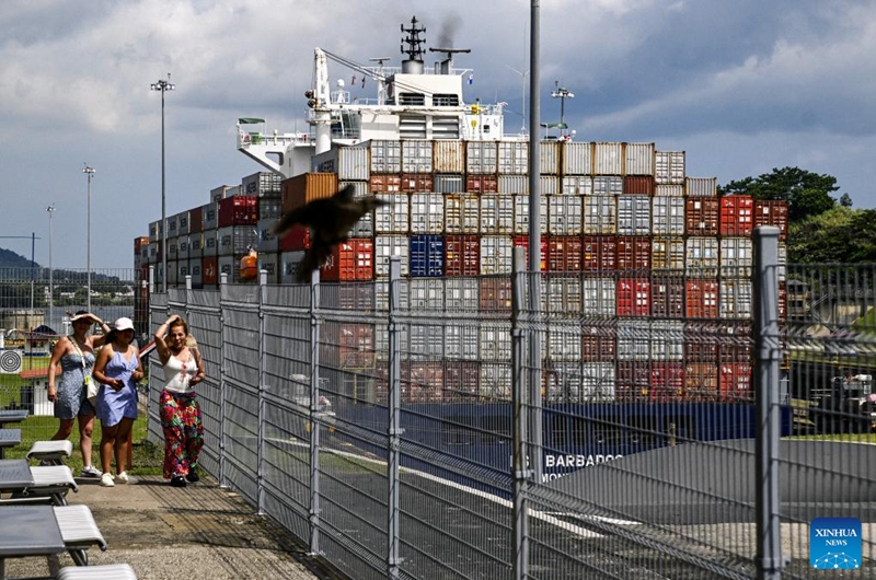 Visitors watch a cargo vessel sailing through the Miraflores Locks on the Panama Canal near Panama City, Panama, Aug. 28, 2024. The Panama Canal, connecting the Pacific and Atlantic Oceans, spans over 80 kilometers and is one of the world's most important trade waterways. The Panama Canal officially opened on Aug. 15, 1914. This year marks the 110th anniversary of its inauguration. Photo: Xinhua