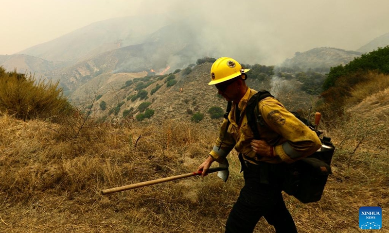 A firefighter works at the site of a wildfire in San Bernardino County, California, the United States, Sept. 7, 2024. An unrelenting heat wave has engulfed Southern California this week with temperatures in some areas reaching record highs on Friday. Hundreds of firefighters are battling a fast-moving wildfire in high temperatures in San Bernardino County, which grew to 1180 acres (about 4.8 square km) with 24 hours. Photo: Xinhua