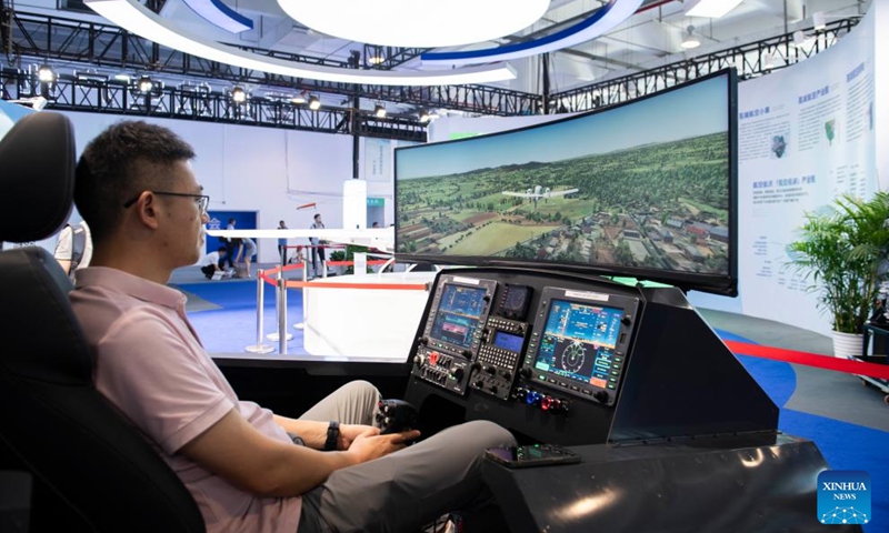 A visitor takes a flight simulator at an exhibition of the 2024 Low Altitude Economic Development Conference in Wuhu, east China's Anhui Province, Sept. 6, 2024. Photo: Xinhua