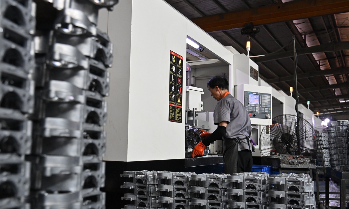 An operator works on an assembly line producing motor bike engine cases in Southwest China's Chongqing Municipality on September 9, 2024. Chongqing's motorbike exports in the first seven months of this year reached 10.89 billion yuan ($1.53 billion), up 19.7 percent year-on-year. Photo: VCG