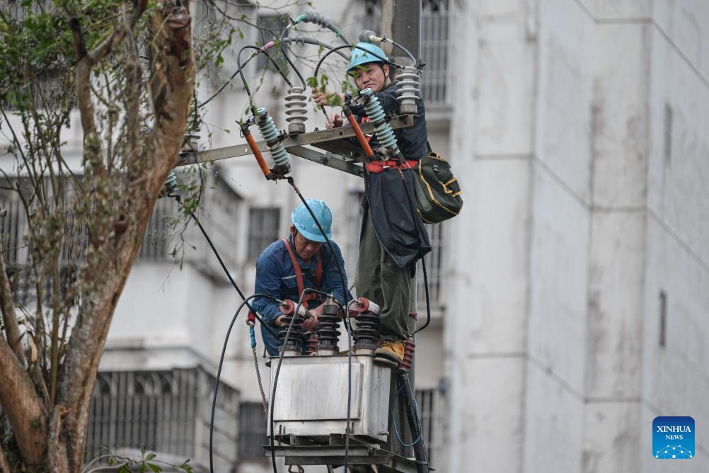 Staff members from a power company based in south China's Guangdong Province repair electrical facilities in Chengmai County, south China's Hainan Province, Sept. 9, 2024. Emergency response workers are busy fixing power supply facilities in Chengmai after Super Typhoon Yagi, the strongest autumn typhoon to land in China since 1949, hit Hainan on Friday. (Photo: Xinhua)