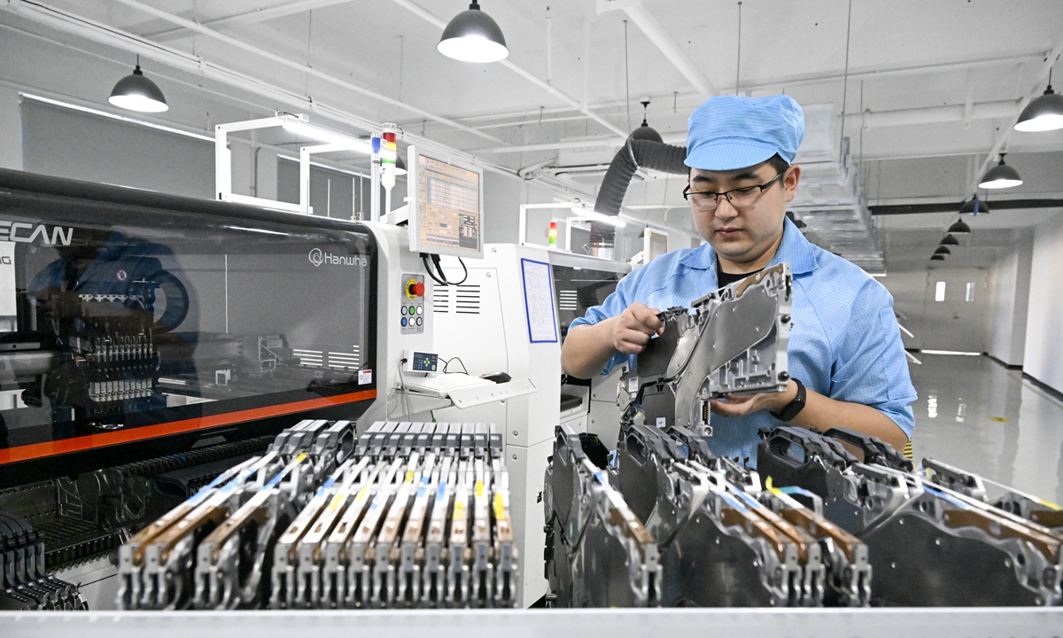 A technician is <strong></strong>busy at a factory in the Luyang Economic Development Zone, in Hefei, capital of East China's Anhui Province, on September 10, 2024. The factory is developing precision quick-return mirrors for aerospace laser communications. Since the beginning of this year, the economic zone, together with some key universities in Hefei such as the University of Science and Technology of China and Hefei University of Technology, has seized opportunities to build industrial clusters around intelligent sensors. Photo: VCG