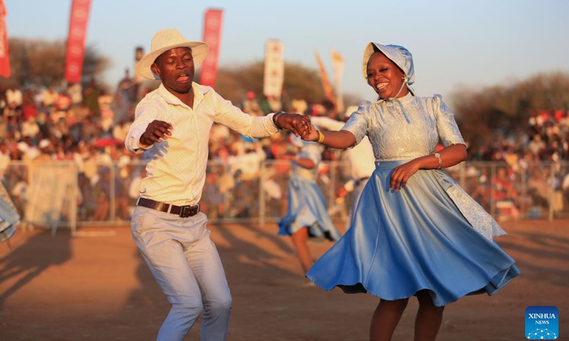 People dance during the Dithubaruba cultural festival in Molepolole village of Botswana on Sept. 7, 2024. The event was held here Saturday to promote Kweneng cultural heritage. It is one of the national events celebrated by Bakwena tribe with various cultural activities ranging from traditional dance, poetry, contemporary music and traditional foods. (Photo: Xinhua)