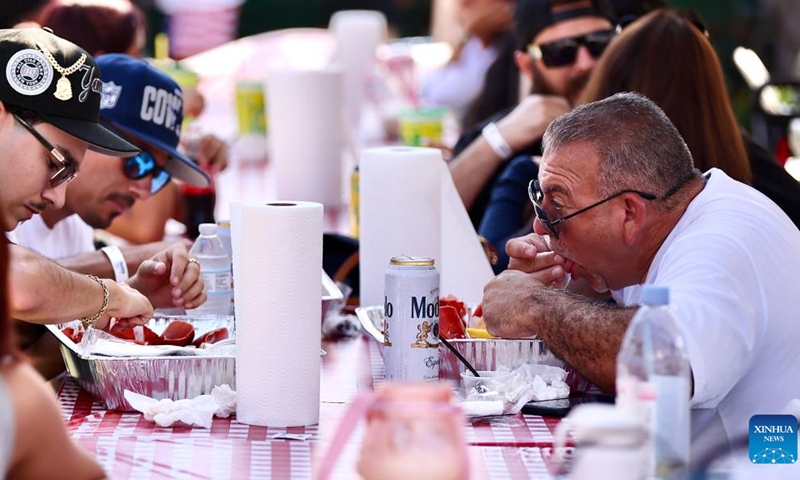 Visitors enjoy lobster meals during the Original Lobster Festival in Fountain Valley, Orange County, California, the United States, Sept. 8, 2024. (Photo: Xinhua)