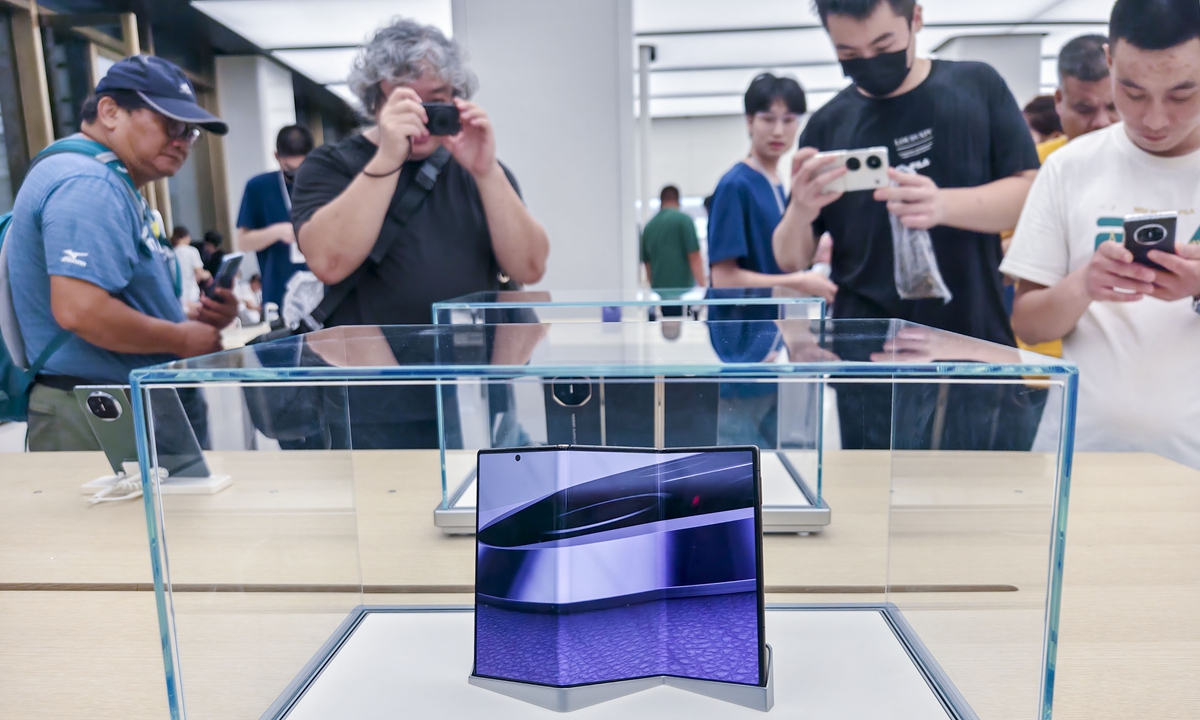 Consumers visit Huawei's global flagship store in Shanghai on September 10,<strong></strong> 2024. Huawei's new triple-fold smartphone - Huawei Mate XT that is debuted on the day - is on display at the store. Huawei Mate XT is the world's first triple-fold smartphone, and also the largest and thinnest foldable handset in the world. Photo: VCG