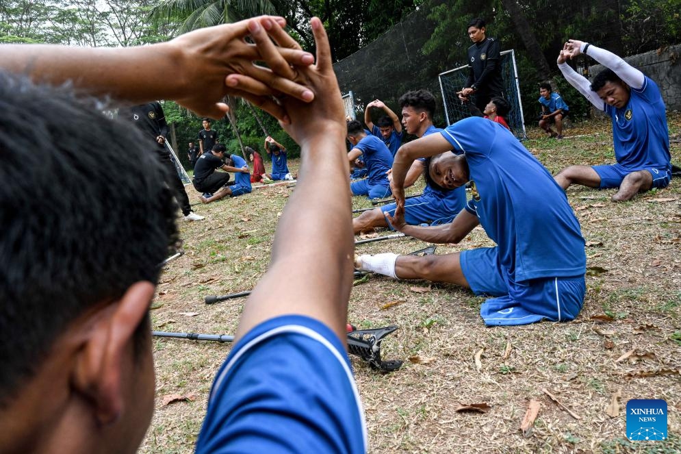 Members of Indonesia Amputee Football (INAF) stretch after a training session on commemoration of the National Sports Day in Jakarta, Indonesia, Sept. 9, 2024. The National Sports Day is celebrated in Indonesia on each year's Sept. 9. (Photo: Xinhua)