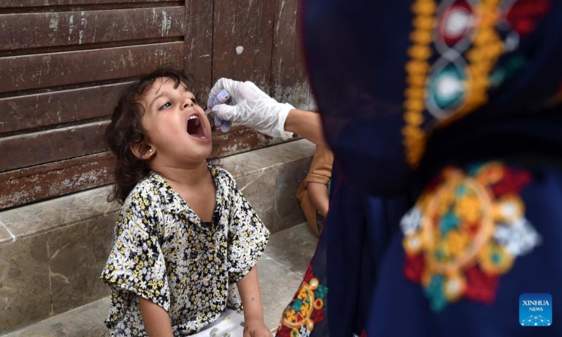 A health worker gives polio vaccination drops to a child during a special nationwide anti-polio campaign in southern Pakistani port city of Karachi on Sept. 9, 2024. Pakistani Prime Minister Shehbaz Sharif on Sunday kicked off a special nationwide anti-polio campaign as part of efforts to completely eradicate polio from the South Asian country. (Photo: Xinhua)