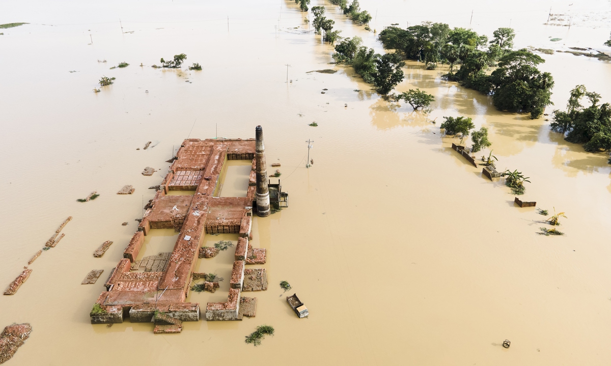 A brickyard and a car are half submerged in flood water in the Chandpur area of Chhagalnaiya upazila of Feni district of Chittagong division of Bangladesh in Feni, Chittagong, Bangladesh, on August 29, 2024. Photo: VCG