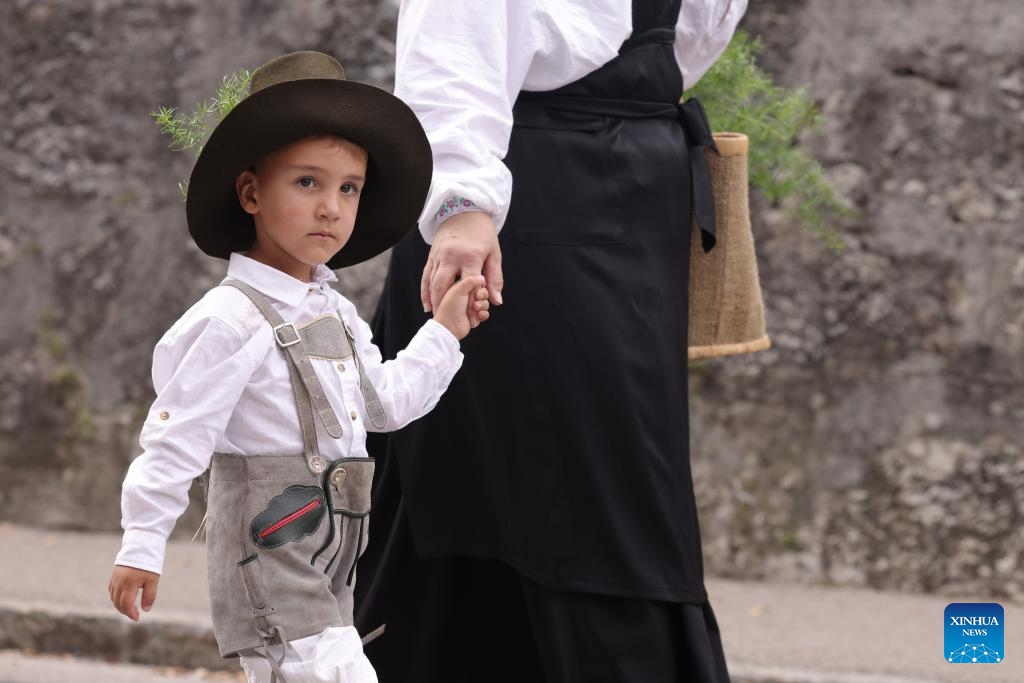 A boy wearing traditional shepherd's costume participates in the parade of the 51st National Costumes and Clothing Heritage Day in Kamnik, Slovenia, Sept. 8, 2024. The 51st National Costumes and Clothing Heritage Day ended Sunday in Kamnik with a traditional parade, during which about 2,000 participants dressed in national costumes walking through the center of Kamnik. (Photo: Xinhua)