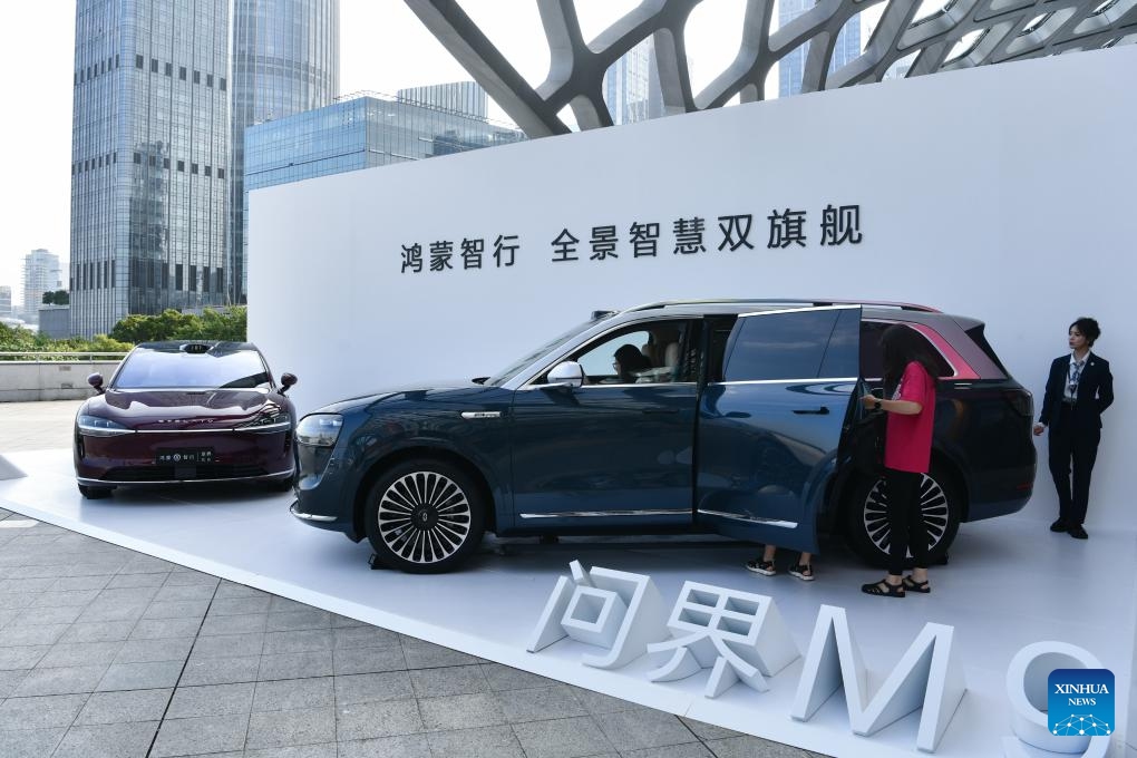 People try out new vehicle models powered by Huawei's Harmony Intelligent Mobility Alliance (HIMA), in Shenzhen, south China's Guangdong Province, Sept. 10, 2024. China's technology giant Huawei unveiled the world's first commercial tri-fold smartphone, the Mate XT, during a new products release event here Tuesday. A new edition of Aito M9 and newly released Luxeed R7, both powered by Huawei's Harmony Intelligent Mobility Alliance (HIMA), were also released during the event. (Photo: Xinhua)