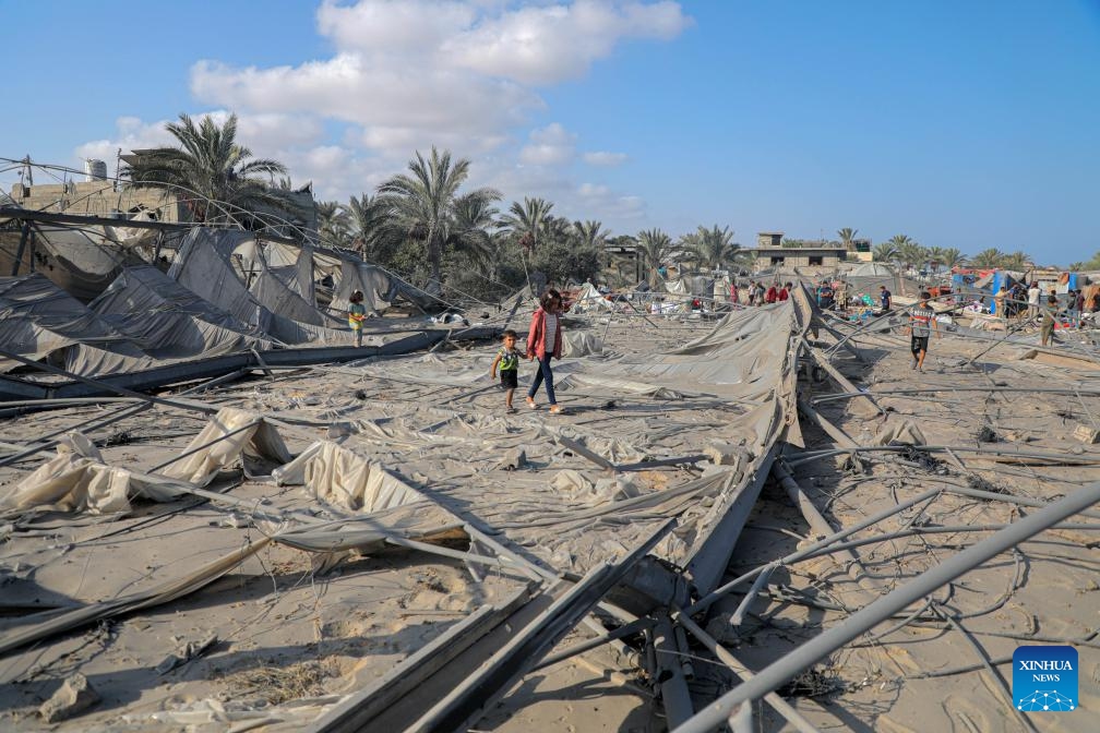 Palestinians check the damage after an Israeli airstrike in the Al-Mawasi area, west of Khan Younis, in the southern Gaza Strip, on Sept. 10, 2024. At least 40 Palestinians were killed and more than 60 others wounded in an Israeli airstrike on tents sheltering displaced people in Khan Younis in southern Gaza, Palestinian and Israeli sources said Tuesday. (Photo: Xinhua)