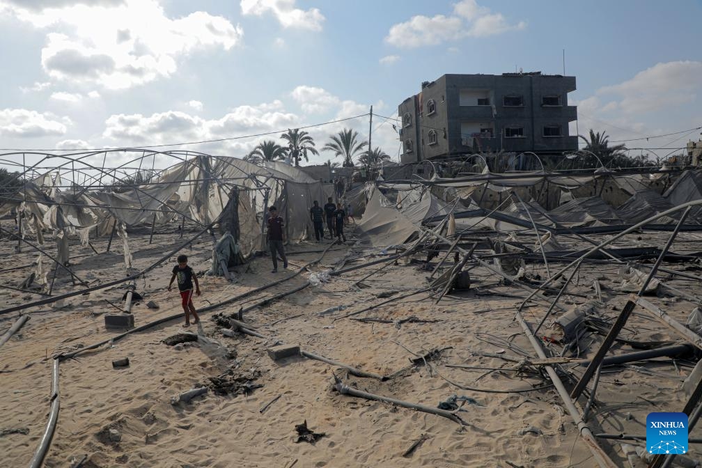 Palestinians check the damage after an Israeli airstrike in the Al-Mawasi area, west of Khan Younis, in the southern Gaza Strip, on Sept. 10, 2024. At least 40 Palestinians were killed and more than 60 others wounded in an Israeli airstrike on tents sheltering displaced people in Khan Younis in southern Gaza, Palestinian and Israeli sources said Tuesday. (Photo: Xinhua)