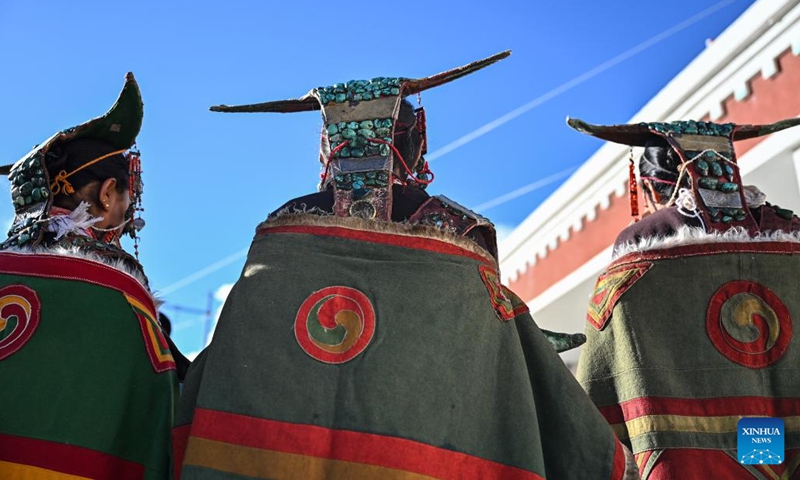 Villagers display folk costume in Kejia Village of Pulan County, southwest China's Xizang Autonomous Region, Sept. 9, 2024. Originating in Pulan County, Pulan folk costume has been a traditional garment worn at celebrations for over a millennium. Weighing more than 20 kilograms, a piece of this unique costume is usually decorated with rare metals and jewels, like gold, silver, beeswax, coral and turquoise. (Photo: Xinhua)