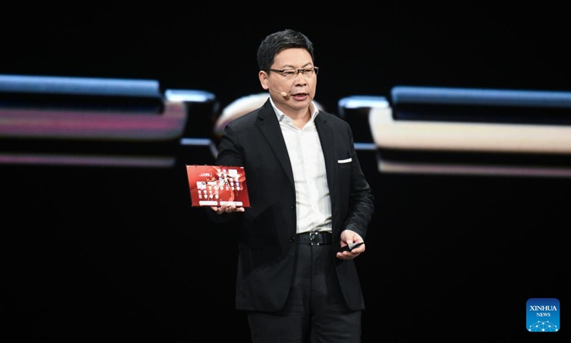 Yu Chengdong, executive director and chairman of the board of directors of the Consumer Business Group of Huawei, displays the world's first commercial tri-fold smartphone, the Mate XT, during a new products release event in Shenzhen, south China's Guangdong Province, Sept. 10, 2024. China's technology giant Huawei unveiled the world's first commercial tri-fold smartphone, the Mate XT, during a new products release event here Tuesday. (Photo: Xinhua)