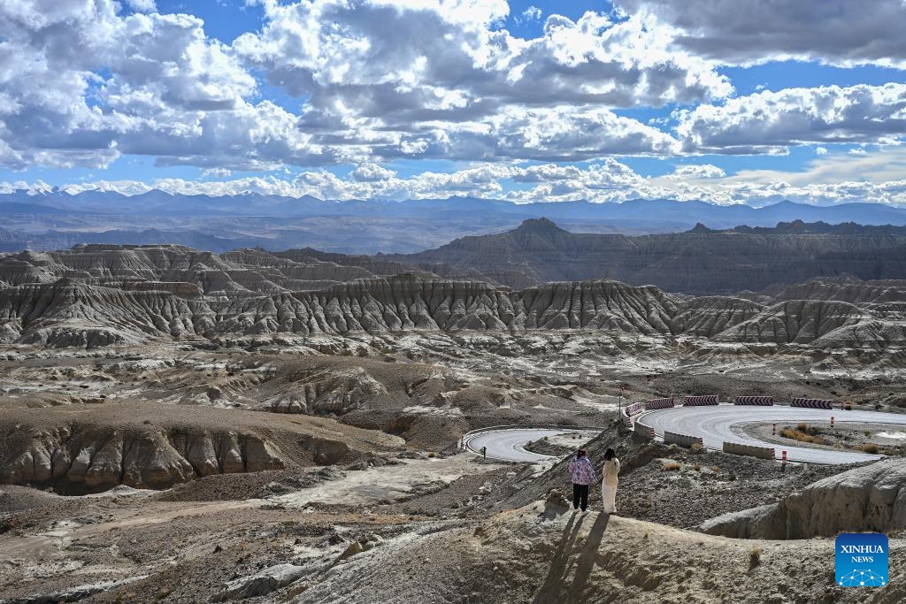 Tourists enjoy the scenery of earth forest in Zanda County of Ngari Prefecture, southwest China's Xizang Autonomous Region, Sept. 9, 2024. Zanda is famous for the unique landscape of earth forest, which was formed by geological movement and soil erosion and listed as a national geological park in 2005. (Photo: Xinhua)