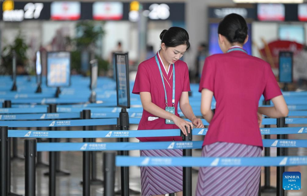 Staff members work at Haikou Meilan International Airport in Haikou, south China's Hainan Province, Sept. 11, 2024. Hainan has witnessed its production gradually resumed after Super Typhoon Yagi, the 11th typhoon of the year, made landfall in Hainan on Friday and brought damage across the island. (Photo: Xinhua)