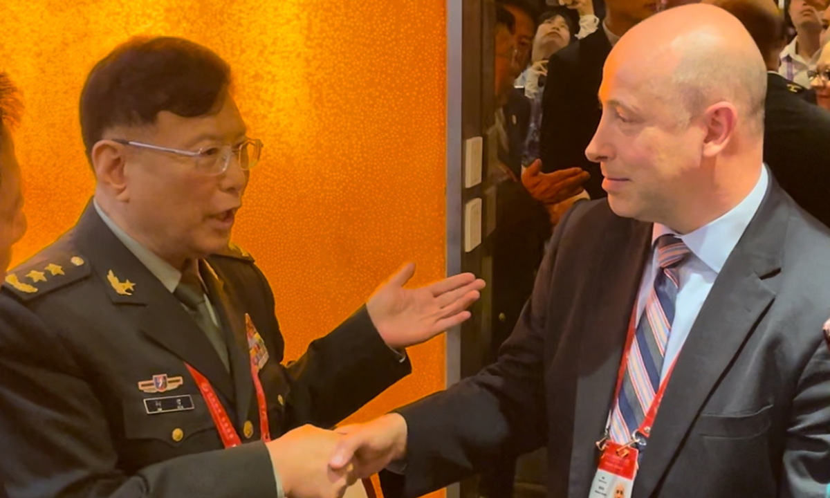 Lieutenant General He Lei (left), former vice president of the Academy of Military Sciences of the PLA, talks with Michael Chase, US deputy assistant secretary of defense, on September 13, 2024, on the sidelines of the Beijing Xiangshan Forum. Photo: Wang Qi/GT