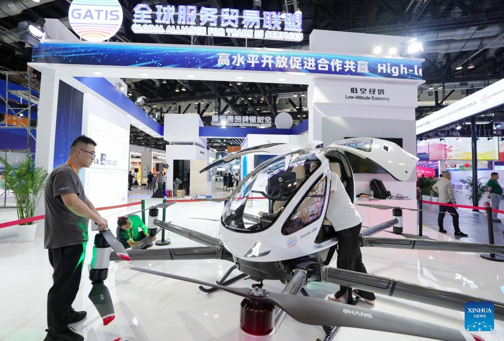 Staff members check an unmanned aerial vehicle at the China National Convention Center in Beijing, capital of China, Sept. 11, 2024. Themed Global Services, Shared Prosperity, the 2024 China International Fair for Trade in Services (CIFTIS) will be held from Sept. 12 to 16 at the China National Convention Center and the Shougang Park in Beijing. (Photo: Xinhua)