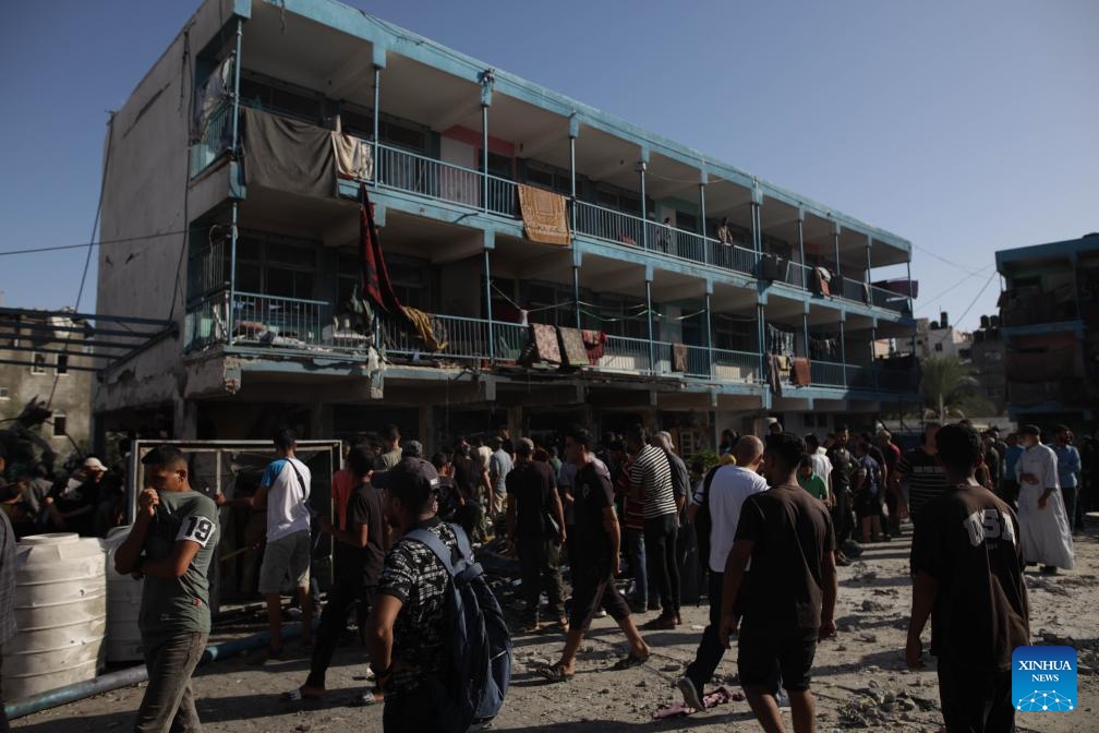 People gather at a UN-run school sheltering displaced people after it was attacked by the Israeli army in the al-Nuseirat refugee camp, central Gaza Strip, on Sept. 11, 2024. At least 14 Palestinians were killed and 10 others wounded in an Israeli airstrike on a UN-run school sheltering displaced people in the central Gaza Strip, according to Palestinian sources on Wednesday. (Photo: Xinhua)