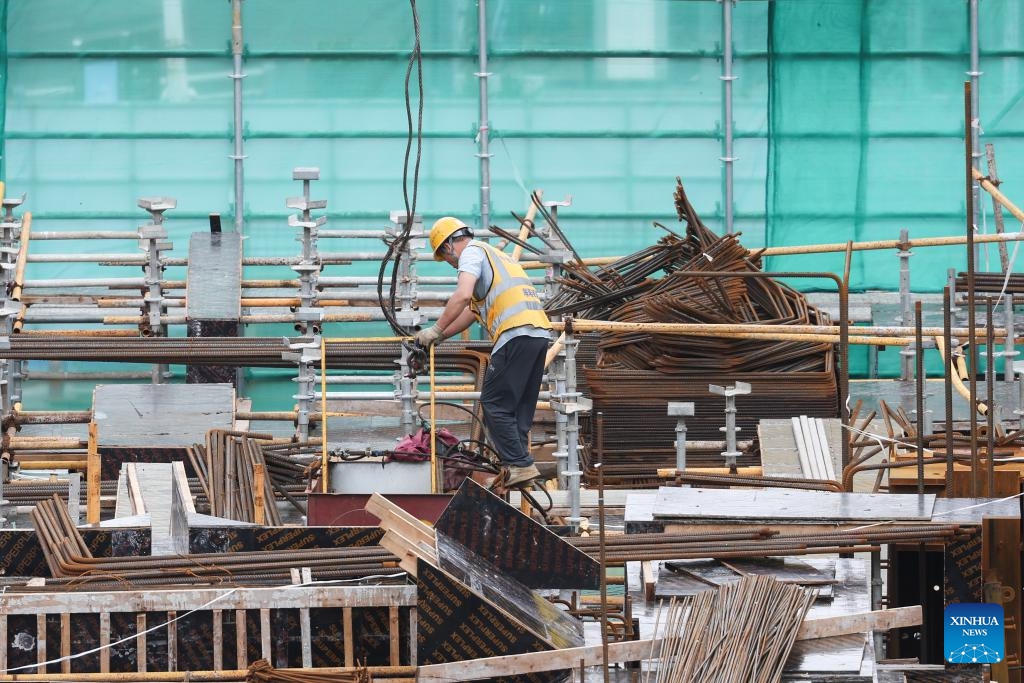 A worker works at a construction site in Haikou, south China's Hainan Province, Sept. 11, 2024. Hainan has witnessed its production gradually resumed after Super Typhoon Yagi, the 11th typhoon of the year, made landfall in Hainan on Friday and brought damage across the island. (Photo: Xinhua)