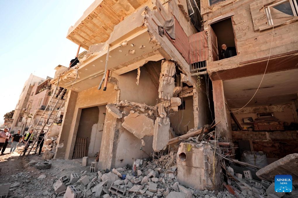 Palestinians check damaged buildings at Nur Shams refugee camp after an Israeli military operation in the West Bank city of Tulkarm and its refugee camps, Sept. 11, 2024. (Photo: Xinhua)