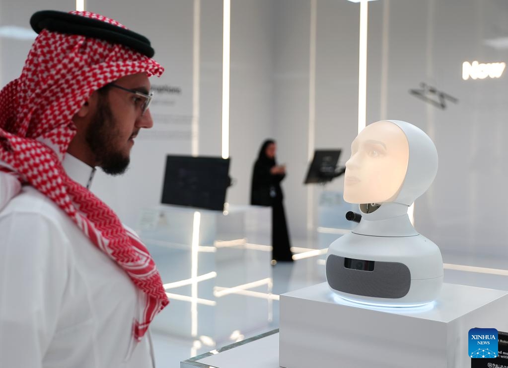 Visitors communicates with a conversational robot during the third edition of the Global AI Summit (GAIN) in Riyadh, Saudi Arabia, Sept. 12, 2024. (Photo: Xinhua)