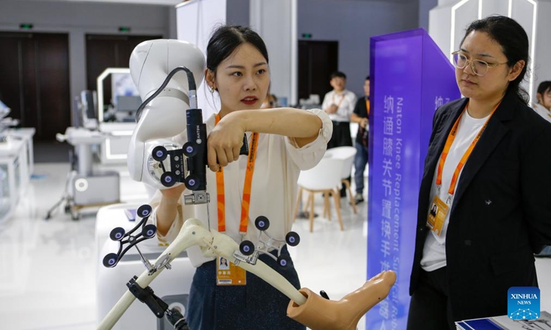 Exhibitors demonstrate a knee replacement surgical robot during the 2024 China International Fair for Trade in Services (CIFTIS) at the China National Convention Center in Beijing, capital of China, Sept. 12, 2024. Themed Global Services, Shared Prosperity, the 2024 CIFTIS opened at the China National Convention Center and the Shougang Park in Beijing on Thursday. (Photo: Xinhua)