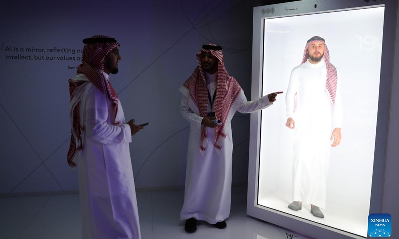 Visitors experience AI conversation during the third edition of the Global AI Summit (GAIN) in Riyadh, Saudi Arabia, Sept. 12, 2024. (Photo: Xinhua)