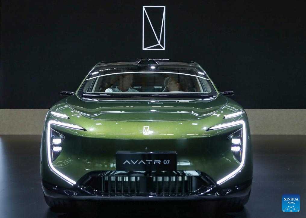 People visit the booth of Hongqi at the Automechanika in Frankfurt, Germany, Sept. 11, 2024. A leading trade fair for the aftermarket sector of the auto industry, Automechanika, kicked off on Tuesday, highlighting electrification and sustainability.(Photo: Xinhua)