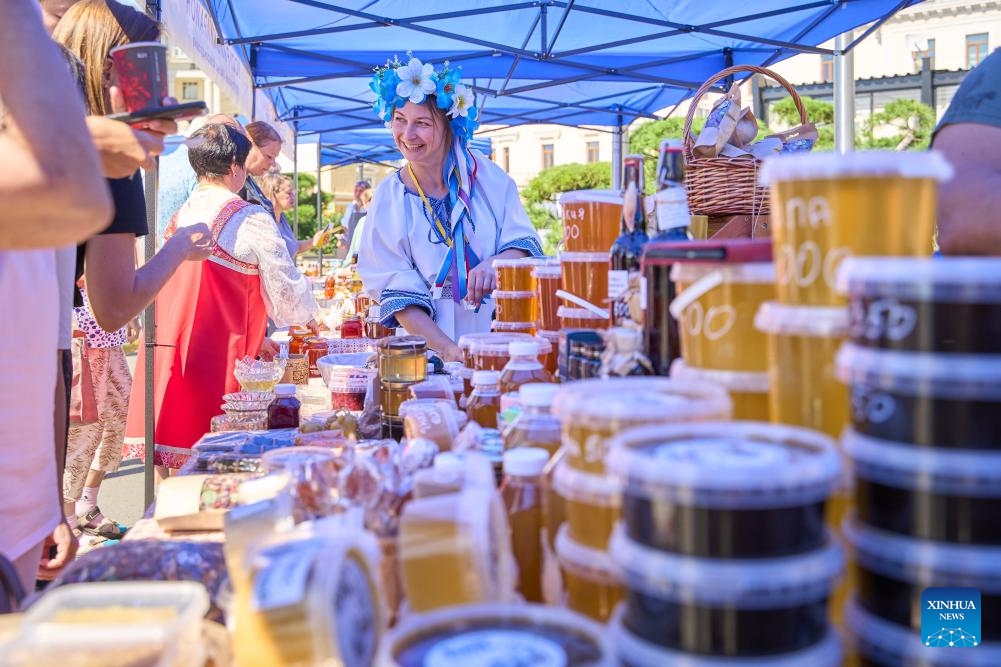 Girls in bee-shaped costumes are pictured during the Honey Day held in Vladivostok, Russia, Sept. 12, 2024. (Photo: Xinhua)