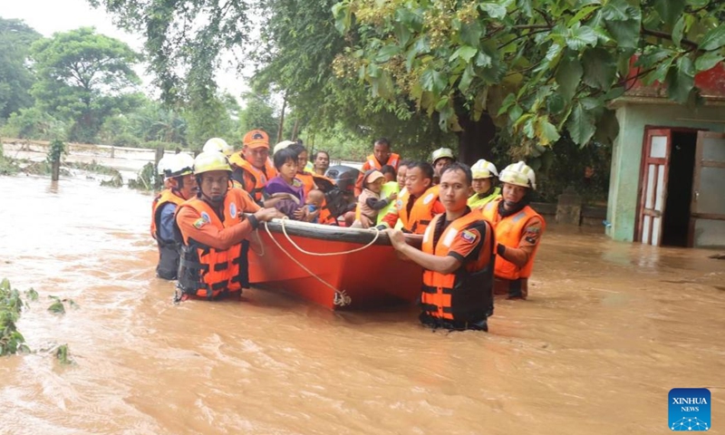 Rescuers evacuate flood victims in Tatkon Township, Nay Pyi Taw, Myanmar, Sept. 12, 2024. (Photo: Xinhua)