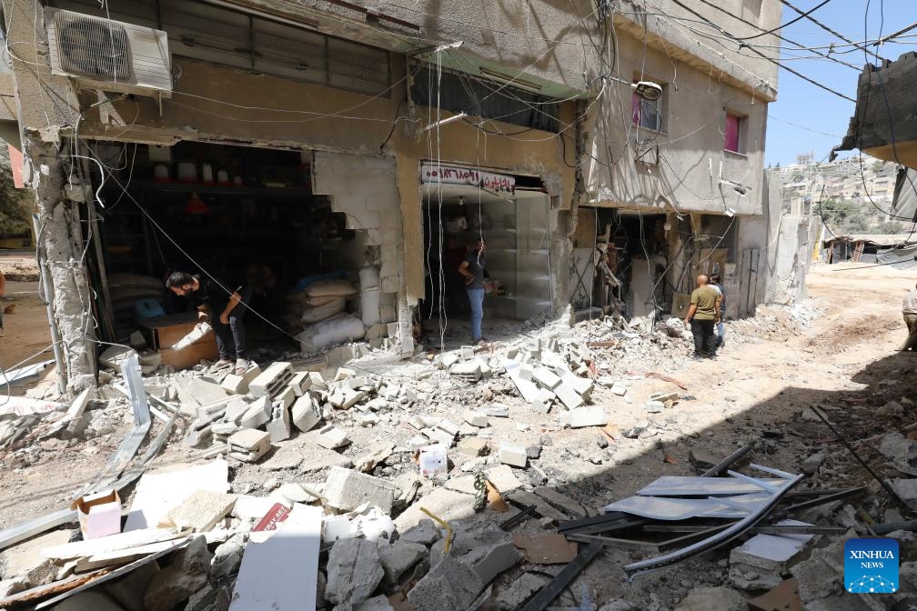 Palestinians inspect the damage of buildings that were attacked by Israeli army in the refugee camp of Tulkarm in the north of the West Bank, Sept. 12, 2024. (Photo: Xinhua)