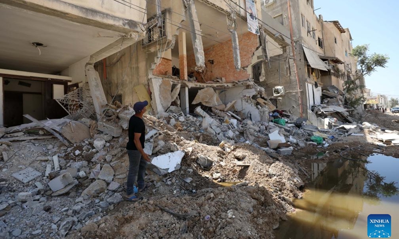 Palestinians inspect the damage of buildings that were attacked by Israeli army in the refugee camp of Tulkarm in the north of the West Bank, Sept. 12, 2024. (Photo: Xinhua)