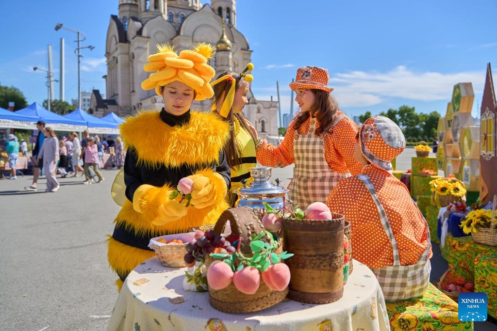 Girls in bee-shaped costumes are pictured during the Honey Day held in Vladivostok, Russia, Sept. 12, 2024. (Photo: Xinhua)