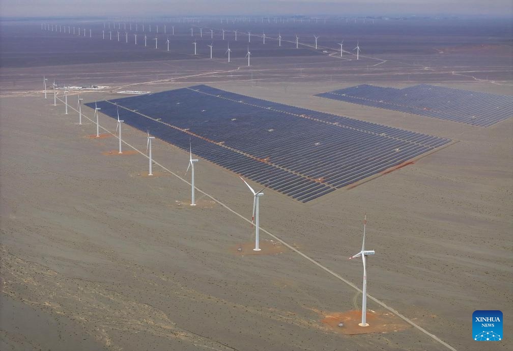 An aerial drone photo taken on Sept. 11, 2024 shows the wind turbines and photovoltaic power generation facilities in Naomaohu Township of Hami City, northwest China's Xinjiang Uygur Autonomous Region. Rich in wind energy resources, Hami is one of the country's major wind power bases. Making the best use of resource advantages, the city has accelerated the development and construction of wind power in recent years to promote green transformation of energy. (Photo: Xinhua)