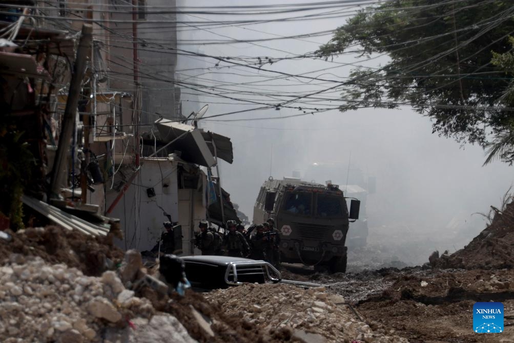 Israeli soldiers and armored vehicles are seen during an Israeli military operation in Tulkarm refugee camp, near the West Bank city of Tulkarm, Sept. 11, 2024. (Photo: Xinhua)