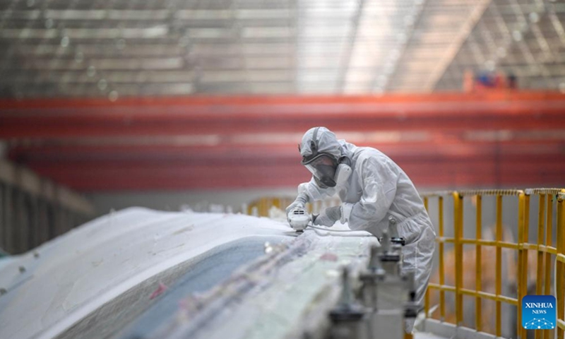 This photo taken on Sept. 10, 2024 shows a work scene at a workshop in an industrial park in Kazak Autonomous County of Barkol, northwest China's Xinjiang Uygur Autonomous Region. Rich in wind energy resources, Hami is one of the country's major wind power bases. Making the best use of resource advantages, the city has accelerated the development and construction of wind power in recent years to promote green transformation of energy. (Photo: Xinhua)