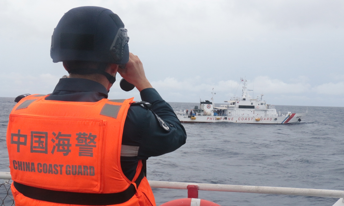 On August 26, 2024, an officer from China Coast Guard monitors Philippine Coast Guard ship 4411 which ilegally intruded into waters near China's Xianbin Jiao. Photo: China Coast Guard