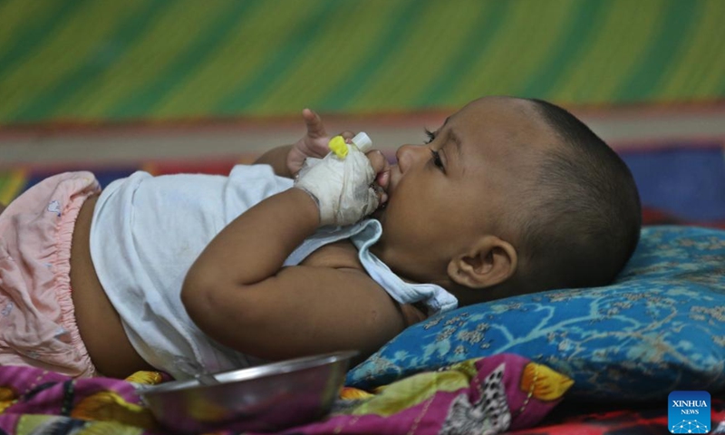 A child infected with dengue receives treatment at a hospital in Dhaka, Bangladesh, Sept. 14, 2024. (Xinhua)