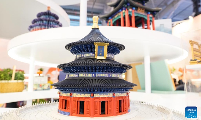 A cultural creative product (front) themed on the Hall of Prayer for Good Harvests, or Qiniandian, of the Tiantan (Temple of Heaven) Park is pictured during the 2024 China International Fair for Trade in Services (CIFTIS) at the Shougang Park in Beijing, capital of China, Sept. 15, 2024. 