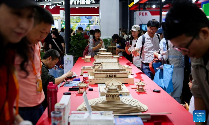 Visitors look at models of the architecture of the Beijing Central Axis during the 2024 China International Fair for Trade in Services (CIFTIS) at the Shougang Park in Beijing, capital of China, Sept. 16, 2024. The 2024 China International Fair for Trade in Services concluded in Beijing on Monday.  (Photo: Xinhua)