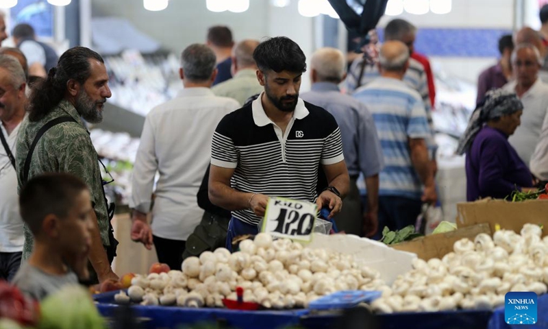 People shop at a local market in Ankara, Türkiye, on Sept. 16, 2024. Easing monetary policy right now is premature as it may hinder disinflation efforts that have yielded successful results in Türkiye, said analysts as Türkiye's central bank is expected to announce the next rate decision this Thursday. (Photo: Xinhua)