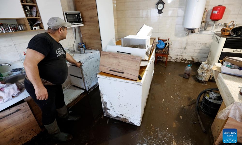 A man cleans his flood-hit house in Galati County, Romania, Sept. 16, 2024. Galati County, Romania, is struggling to recover from the severe floods brought by Cyclone Boris on Saturday, which has claimed five lives and displaced over 250 residents.  (Photo: Xinhua)