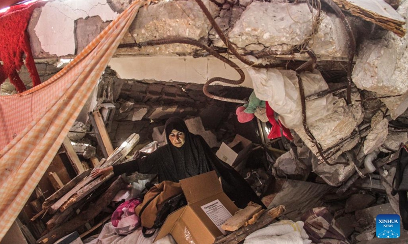 A Palestinian woman is seen in a tent set on the rubble of a destructed house in the refugee camp of Jabalia, northern Gaza Strip, on Sept. 16, 2024. (Photo: Xinhua)