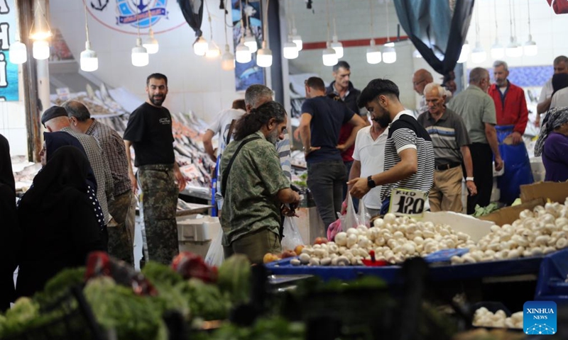 People shop at a local market in Ankara, Türkiye, on Sept. 16, 2024. Easing monetary policy right now is premature as it may hinder disinflation efforts that have yielded successful results in Türkiye, said analysts as Türkiye's central bank is expected to announce the next rate decision this Thursday. (Photo: Xinhua)