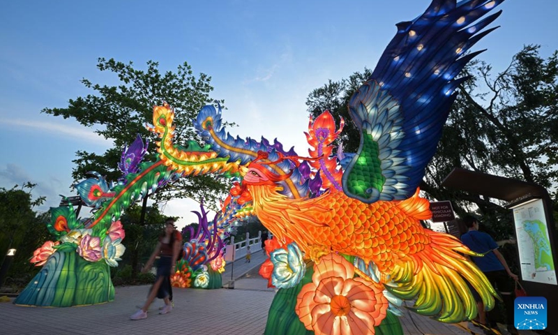 People visit the Lights by the Lake event held to celebrate the Mid-Autumn Festival in Singapore on Sept. 16, 2024. (Photo: Xinhua)