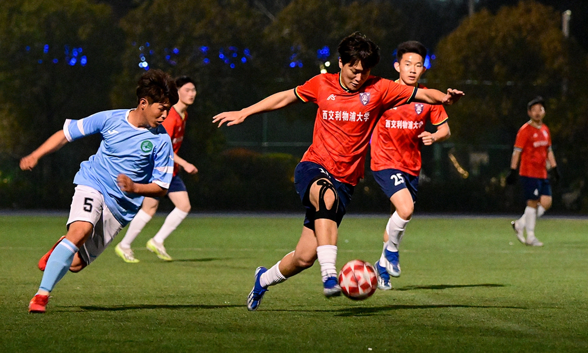 College students compete in a match during the first Suzhou College Student Football League in Suzhou, East China's Jiangsu Province, on March 19, 2024. Photo: VCG